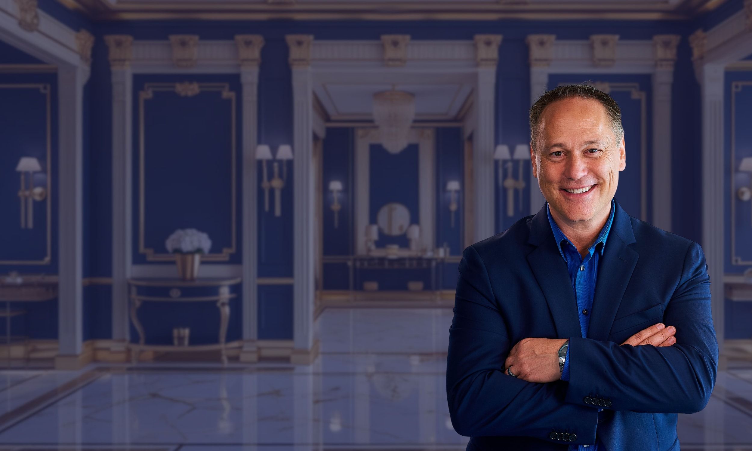 Trevor McGregor standing in an elegant blue hall